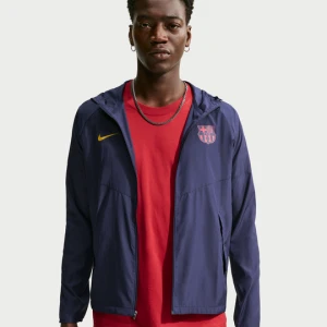 Męska kurtka piłkarska do biegania Nike FC Barcelona City Side - Niebieski