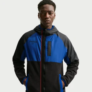 Męska kurtka piłkarska na zimę Nike Paris Saint-Germain AWF - Niebieski