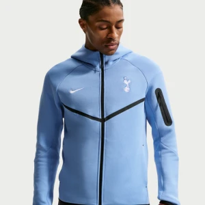 Męska piłkarska bluza z kapturem i zamkiem na całej długości Nike Football Tottenham Hotspur Tech Fleece Windrunner - Niebieski