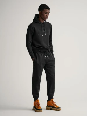 Spodnie dresowe z tarczą w kolorze tła GANT