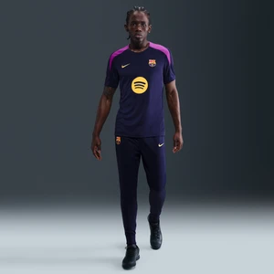 Męskie dresowe spodnie piłkarskie z dzianiny Nike Dri-FIT FC Barcelona Strike - Fiolet
