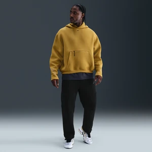 Męskie dzianinowe spodnie z luźnymi nogawkami Nike Tech - Czerń