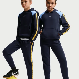 Męskie joggery piłkarskie z dzianiny Nike Tottenham Hotspur City Side - Niebieski