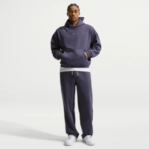 Męskie spodnie do koszykówki ze szczotkowanej dzianiny z luźnymi nogawkami Therma-FIT Nike Standard Issue - Szary