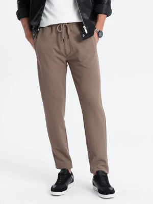 Męskie spodnie dresowe o marchewkowym kroju - brązowe V2 OM-PASK-0166
 -                                    L