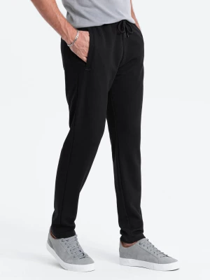 Męskie spodnie dresowe o marchewkowym kroju - czarne V1 OM-PASK-0166
 -                                    L
