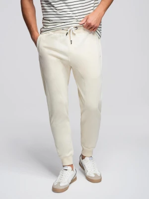 Męskie spodnie dresowe typu jogger - kremowe V11 - Rozmiar: M Ombre Clothing