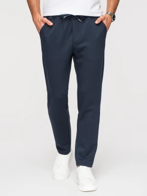 Męskie spodnie dresowe z prostą nogawką z gładkiej dzianiny - granatowe V4 - Rozmiar: S Ombre Clothing