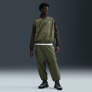 Męskie spodnie dresowe z tkaniny o kroju oversize Nike Club - Zieleń