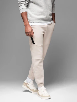 Męskie spodnie dresowe ze ściągaczami i ozdobnym zamkiem – piaskowe V6 Ombre Clothing