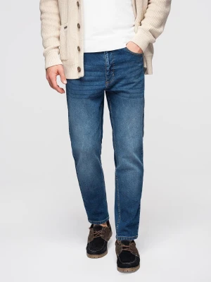 Męskie spodnie jeansowe CARROT z przetarciami - niebieskie V2 - Rozmiar: M Ombre Clothing