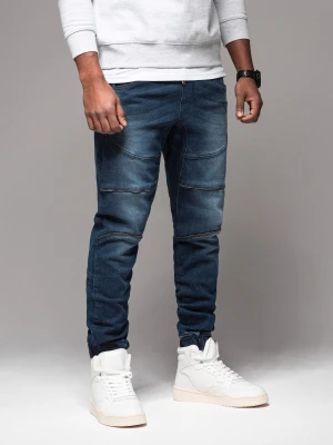 Męskie spodnie jeansowe joggery z przetarciami i zamkami – ciemnoniebieskie V1 - Rozmiar: S Ombre Clothing