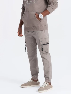 Męskie spodnie JOGGERY z zapinanymi kieszeniami cargo - ciemnobeżowe V2 OM-PAJO-0125
 -                                    L