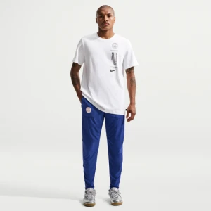 Męskie spodnie piłkarskie Nike Paris Saint-Germain City Style - Niebieski