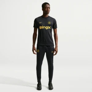 Męskie spodnie piłkarskie z dzianiny Nike Dri-FIT Chelsea F.C. Strike - Niebieski