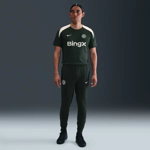 Męskie spodnie piłkarskie z dzianiny Nike Dri-FIT Chelsea F.C. Strike - Zieleń