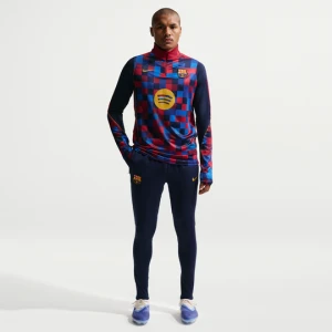 Męskie spodnie piłkarskie z dzianiny Nike Dri-FIT FC Barcelona Strike - Niebieski