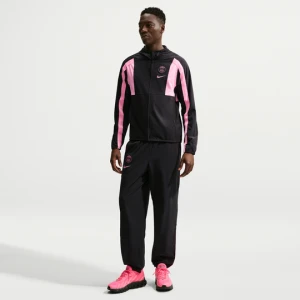 Męskie spodnie piłkarskie z tkaniny Nike Paris Saint-Germain Energy - Czerń