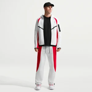 Męskie spodnie z dzianiny w kontrastowych kolorach z luźnymi nogawkami Nike Tech - Biel