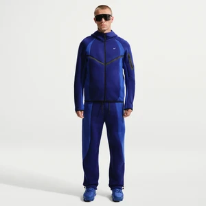 Męskie spodnie z dzianiny w kontrastowych kolorach z luźnymi nogawkami Nike Tech - Niebieski