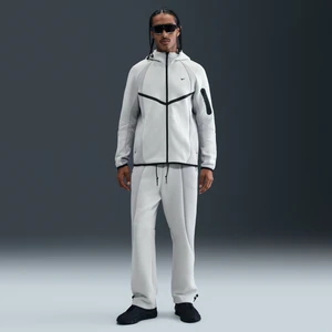 Męskie spodnie z dzianiny w kontrastowych kolorach z luźnymi nogawkami Nike Tech - Szary