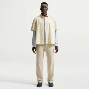 Męskie spodnie z dzianiny z luźnymi nogawkami Nike Club - Brązowy