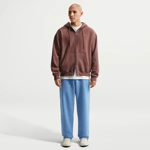 Męskie spodnie z dzianiny z luźnymi nogawkami Nike Solo Swoosh - Niebieski