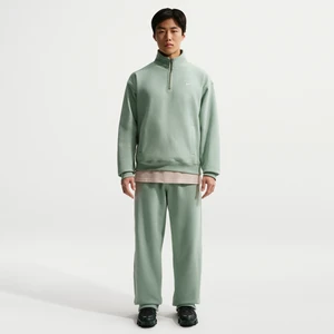 Męskie spodnie z dzianiny z luźnymi nogawkami Nike Solo Swoosh - Zieleń