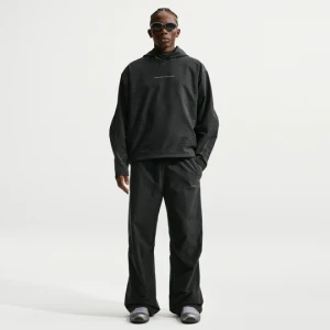 Męskie spodnie z dzianiny z luźnymi nogawkami Nike Tech Dri-FIT Shori - Czerń