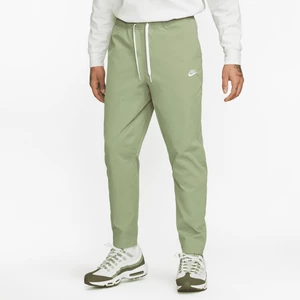 Męskie spodnie z tkaniny o zwężanym kroju Nike Club - Zieleń