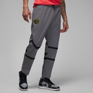 Męskie spodnie z tkaniny Paris Saint-Germain - Szary Nike