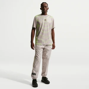 Męskie spodnie z tkaniny z grafiką Nike Windrunner - Brązowy