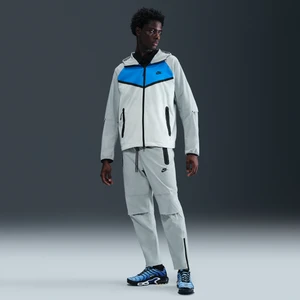 Męskie spodnie z tkaniny z luźnymi nogawkami Nike Tech - Szary