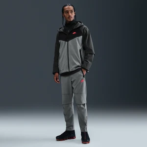 Męskie spodnie z tkaniny z luźnymi nogawkami Nike Tech - Szary