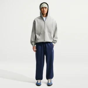 Męskie spodnie ze ściągaczem Nike Solo Fleece - Niebieski