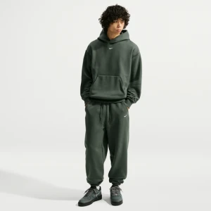 Męskie spodnie ze ściągaczem Nike Solo Fleece - Zieleń