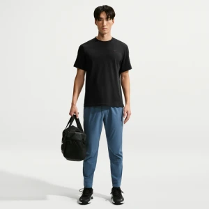 Męskie uniwersalne spodnie ze ściągaczami i zamkami Dri-FIT Nike Unlimited - Niebieski