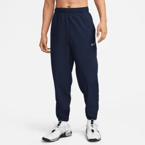 Męskie uniwersalne spodnie ze zwężanymi nogawkami Dri-FIT Nike Form - Niebieski