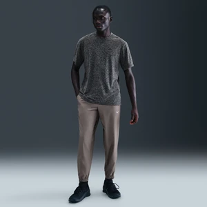 Męskie uniwersalne spodnie ze zwężanymi nogawkami Dri-FIT Nike Form - Szary