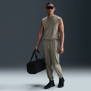 Męskie uniwersalne spodnie ze zwężanymi nogawkami Dri-FIT Nike Form - Zieleń