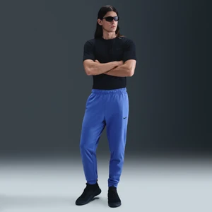 Męskie zwężane spodnie do fitnessu Therma-FIT Nike Therma - Niebieski