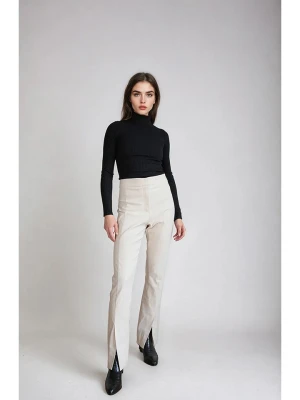 Monki Spodnie w kolorze kremowym rozmiar: 44