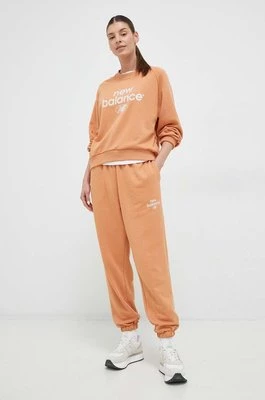 New Balance spodnie dresowe kolor pomarańczowy z nadrukiem WP31508SEI-SEI