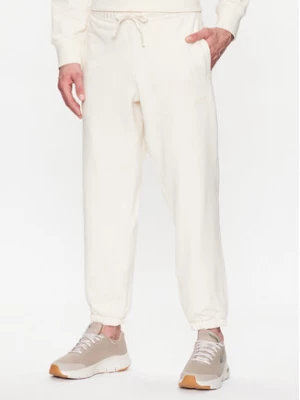 New Balance Spodnie dresowe MP23551 Écru Relaxed Fit
