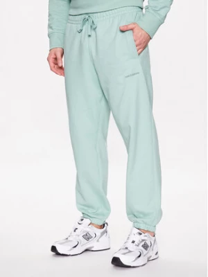New Balance Spodnie dresowe MP23551 Zielony Relaxed Fit