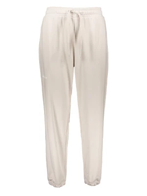 New Balance Spodnie dresowe w kolorze kremowym rozmiar: M