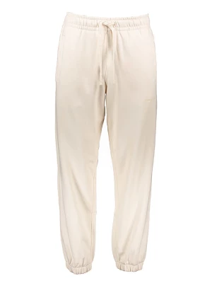 New Balance Spodnie dresowe w kolorze kremowym rozmiar: XL