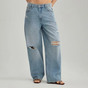 Niebieskie jeansy baggy fit z dziurami House