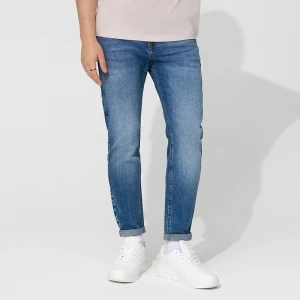 Niebieskie jeansy carrot fit z dodatkiem elastanu i efektem sprania House