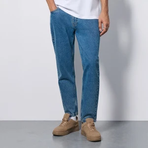 Niebieskie jeansy carrot fit z marmurkowym efektem sprania House